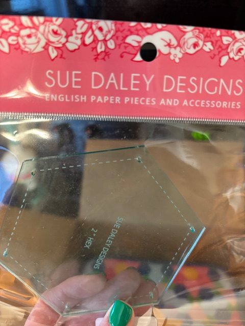 A transparent packaging featuring a hexagonal template from Sue Daley Designs, labeled 'English Paper Pieces and Accessories'.